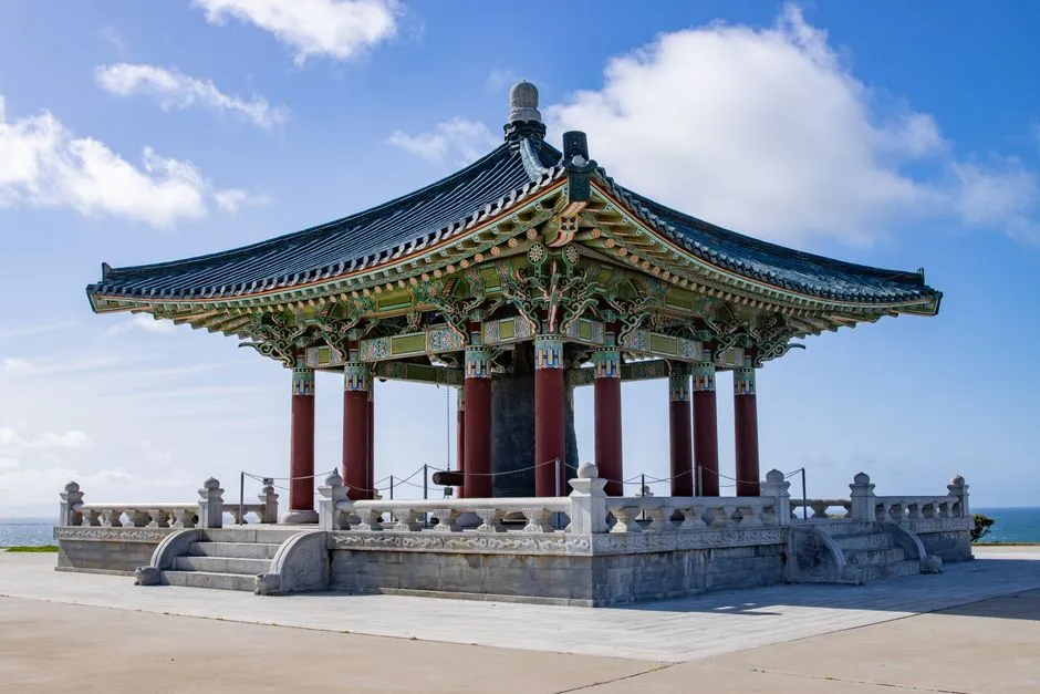 The Korean Friendship Bell pavilion under a clear blue sky in San Pedro, California.